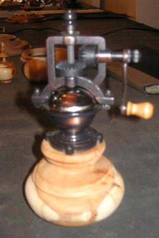 Pepper mill mounted on a yew base